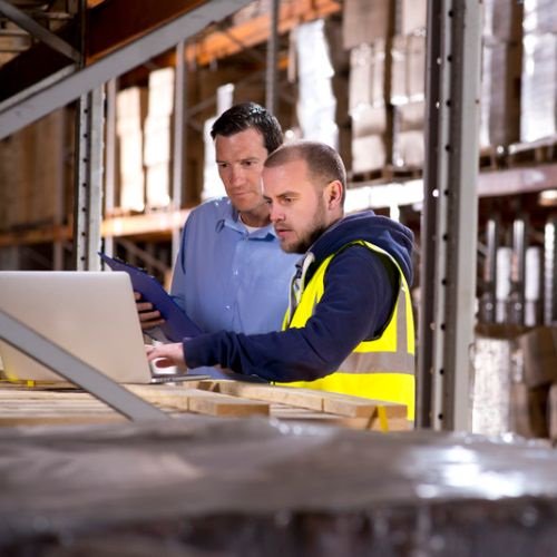 warehouse workers operate legacy inventory software instead of secure modern mobile software